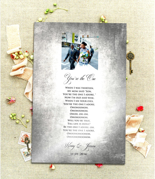 A Vintage, Custom Tin Portrait with song plaque is laid on a linen cloth with sprigs of poppies and brass antique keys. The Tin plaque is tarnished and aged for a vintage styling and features a cameo photo motif at the top of the plate and song lyrics, names and wedding date below. The song title and the couple's names are inscribed with elegant and romantic scripted lettering. Photo Courtesy of Honeycomb Proverbs