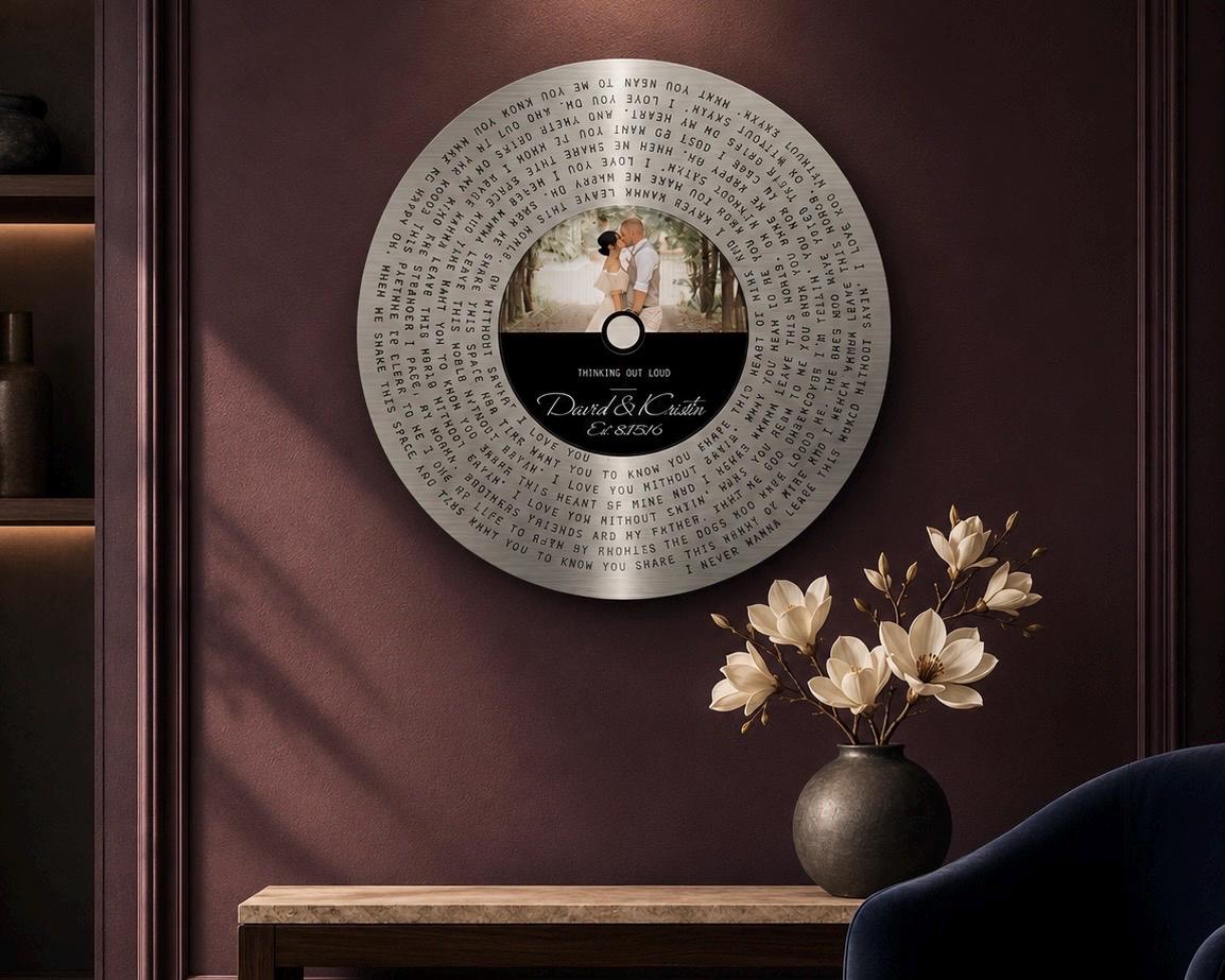 Round tin song lyrics record with spiral first dance lyrics, displayed in a styled room