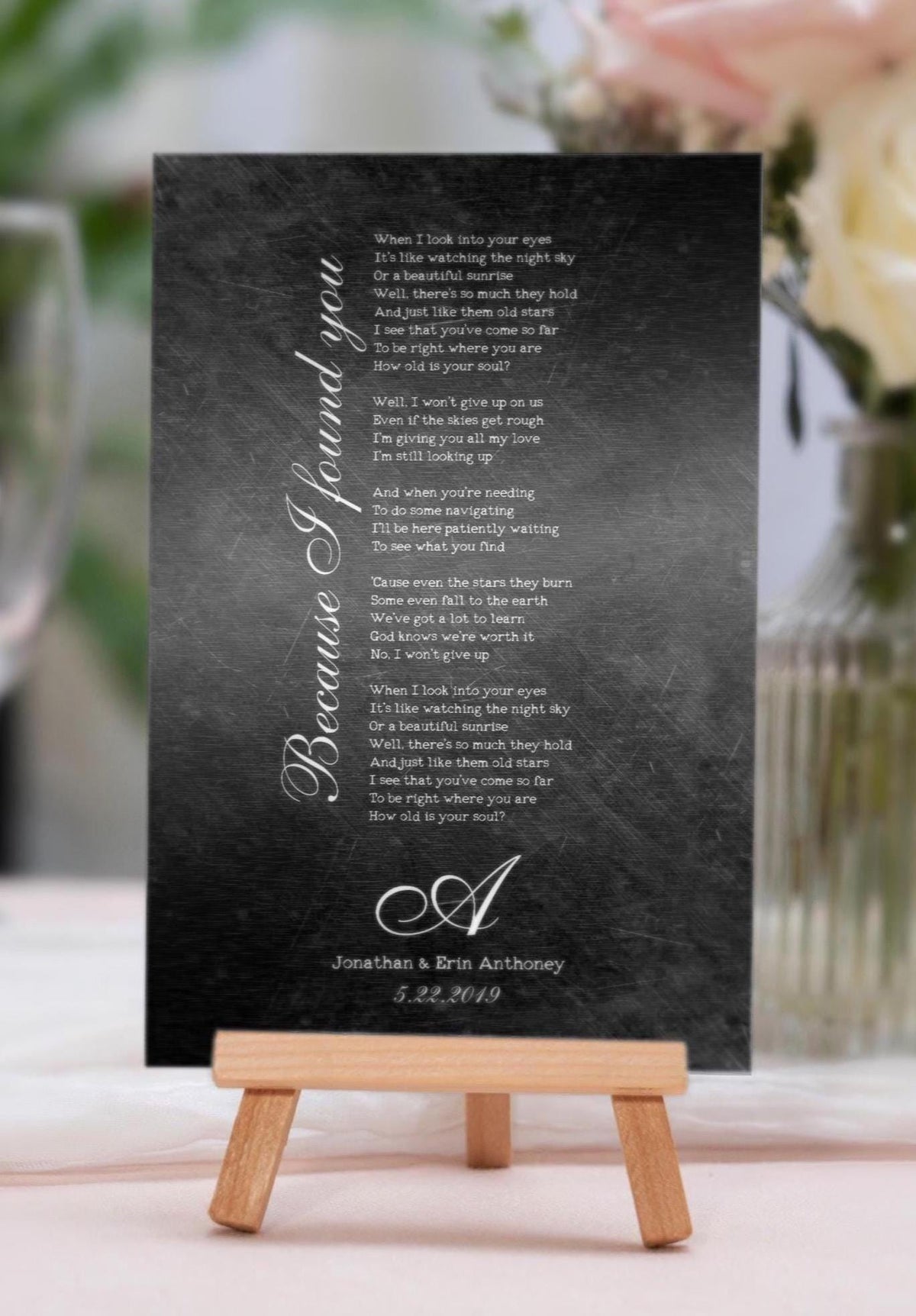 Distressed dark iron alloy song lyric plaque on a tabletop easel, song title along the left side, 6th anniversary iron
