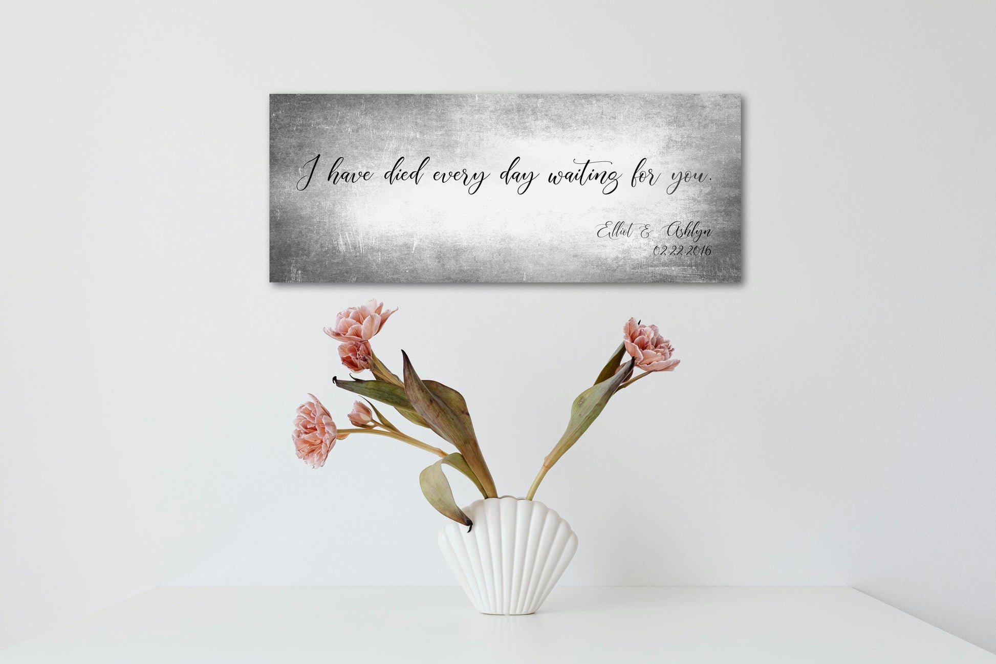 Custom Tanished Tin Quote Sign -
Tarnished silver metal sign. Featured example uses the quote "I have died every day waiting for you" and includes the names Elliot and Ashlyn on the bottom right corner as a tribute to their wedding anniversary. The date 2.22.2016 is inscribed beneath the names.

Photo Courtesy of Honeycomb Proverbs