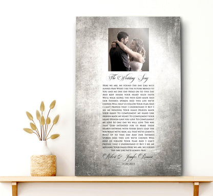 Custom Portrait plaque on tin for couples. Features the song lyrics or wording of choice and a photo cameo above the lyrics. This piece is handcrafted on vintage tin and is displayed on a single shelf with a rustic vase on the shelf to the left.  Courtesy of Honeycomb Proverbs