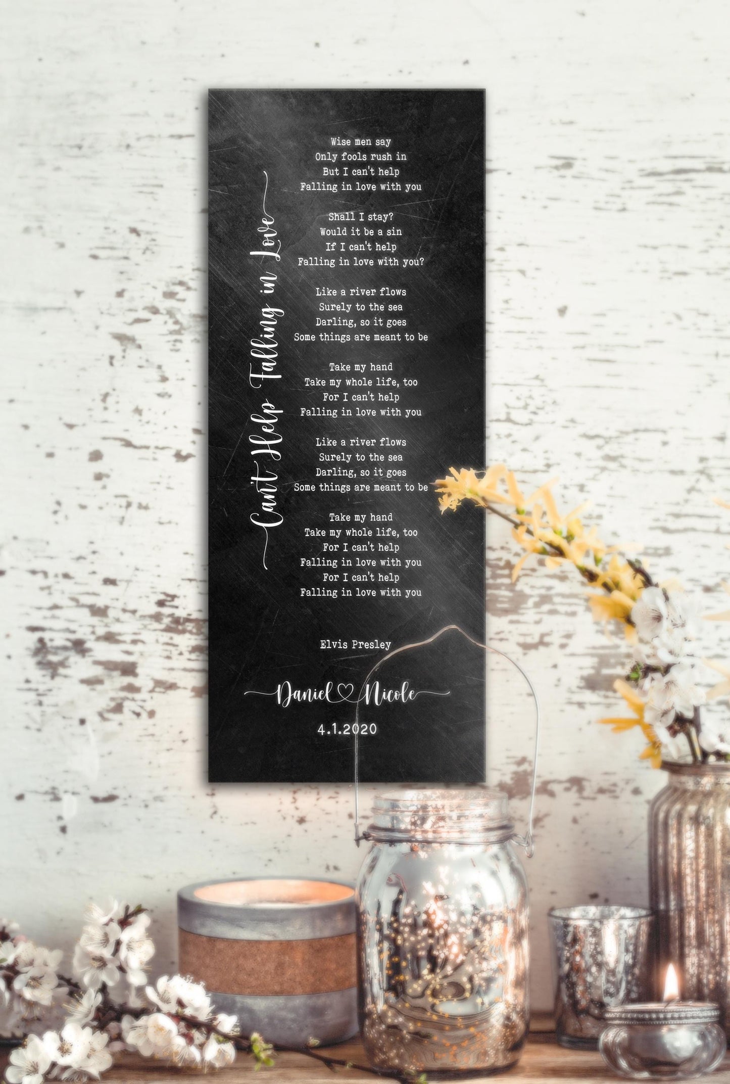 Song lyric metal sign in a black distressed iron alloy with the song cant help falling in love