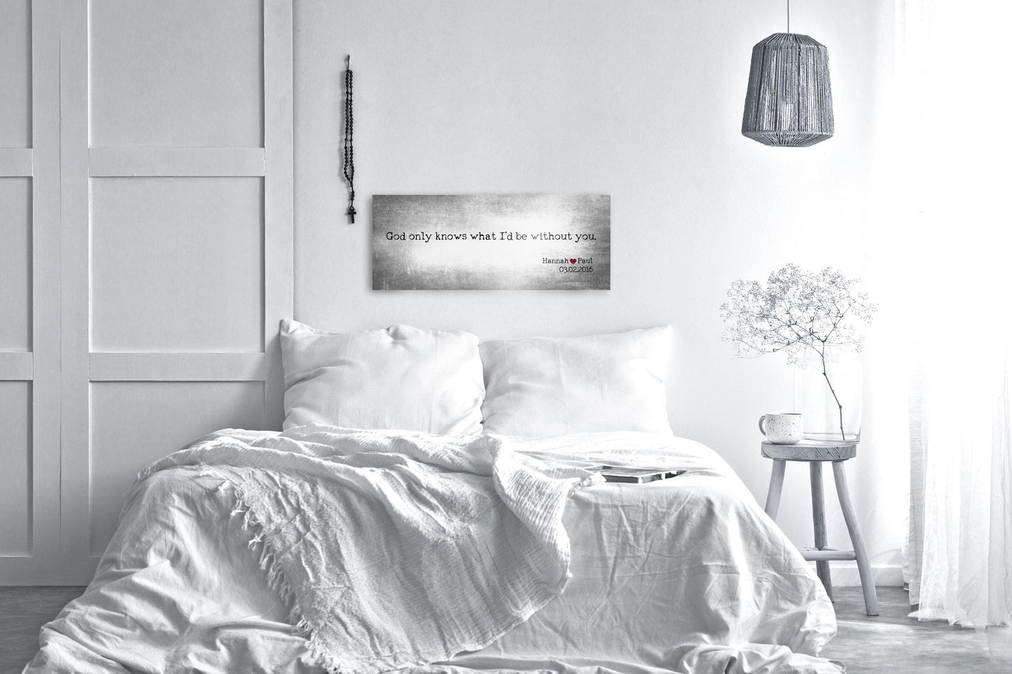 Custom Quote Art on Tin:
Tarnished silver tin metal sign with the words God only knows what I'd do without you inscribed in black and the names Hannah and Paul joined by a red heart, and their union date on the lower right corner of the sign. The sign hangs above a white bed.

Photo courtesy of Honeycomb Proverbs