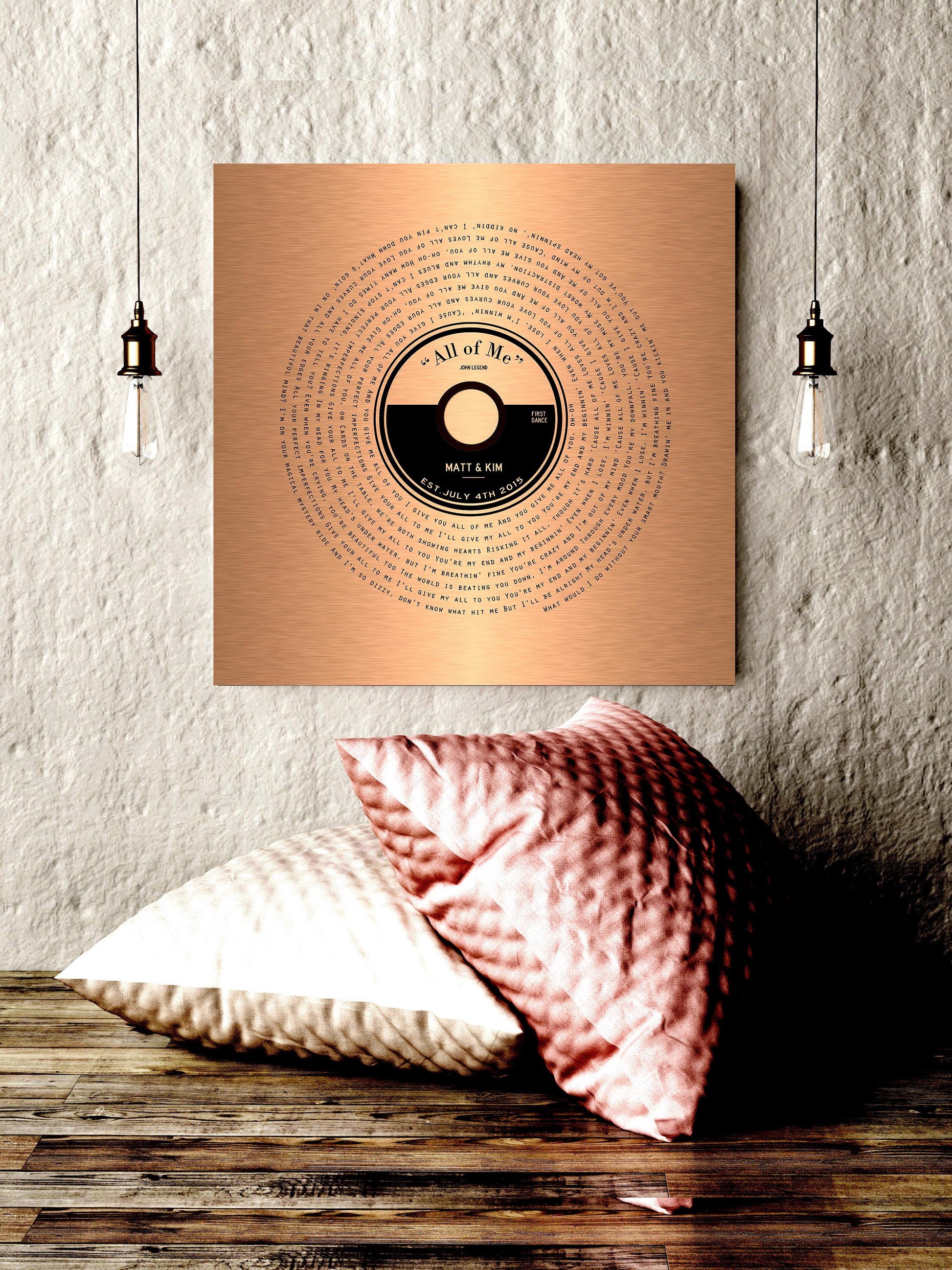 A custom copper song record art with personalized record label and song lyrics that wind around the round record label to crest a vinyl record design.