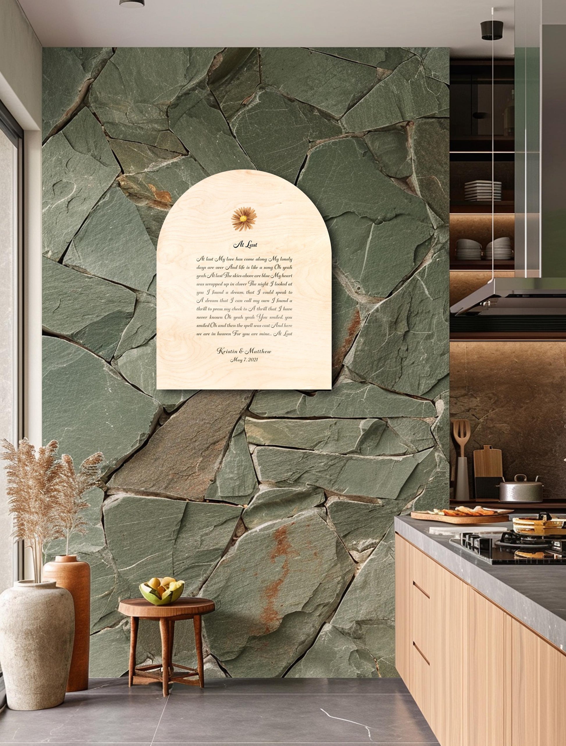 Custom lyrics song plaque in an arch shaped on natural pine, features a yellow colored daisy flower motif seated above the song title "At Last" with the lyrics beneath. The plaque is finished with the names and wedding date of the recipient of this couple's plaque. The inscription is an elegant yet easily readable calligraphy script in deep brown.