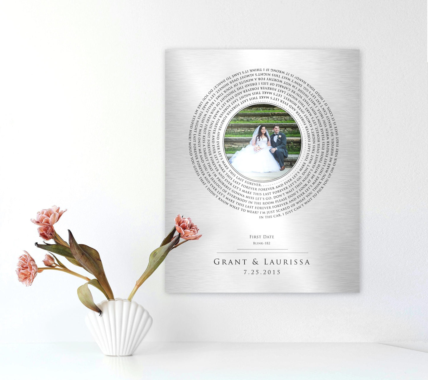 tin, 10 year anniversary record and photo plaque with a wedding portrait taking the place of a record label, and personalized song lyrics spiraling around the "label". Names and a wedding date sit below, as well as an artist credit and song title referencing the lyrics used on the record motif