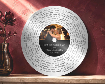 Tin photo and song round lyrics record with couple names and wedding date on a black label