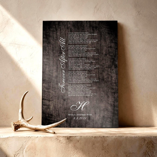 Wooden Anniversary Gift Decor custom designed for him or her with song lyrics of choice, names and date. Featured on a rustic barn grey finish leaning on a shelf with a lone antler sharing the frame in the lower left third of the image.